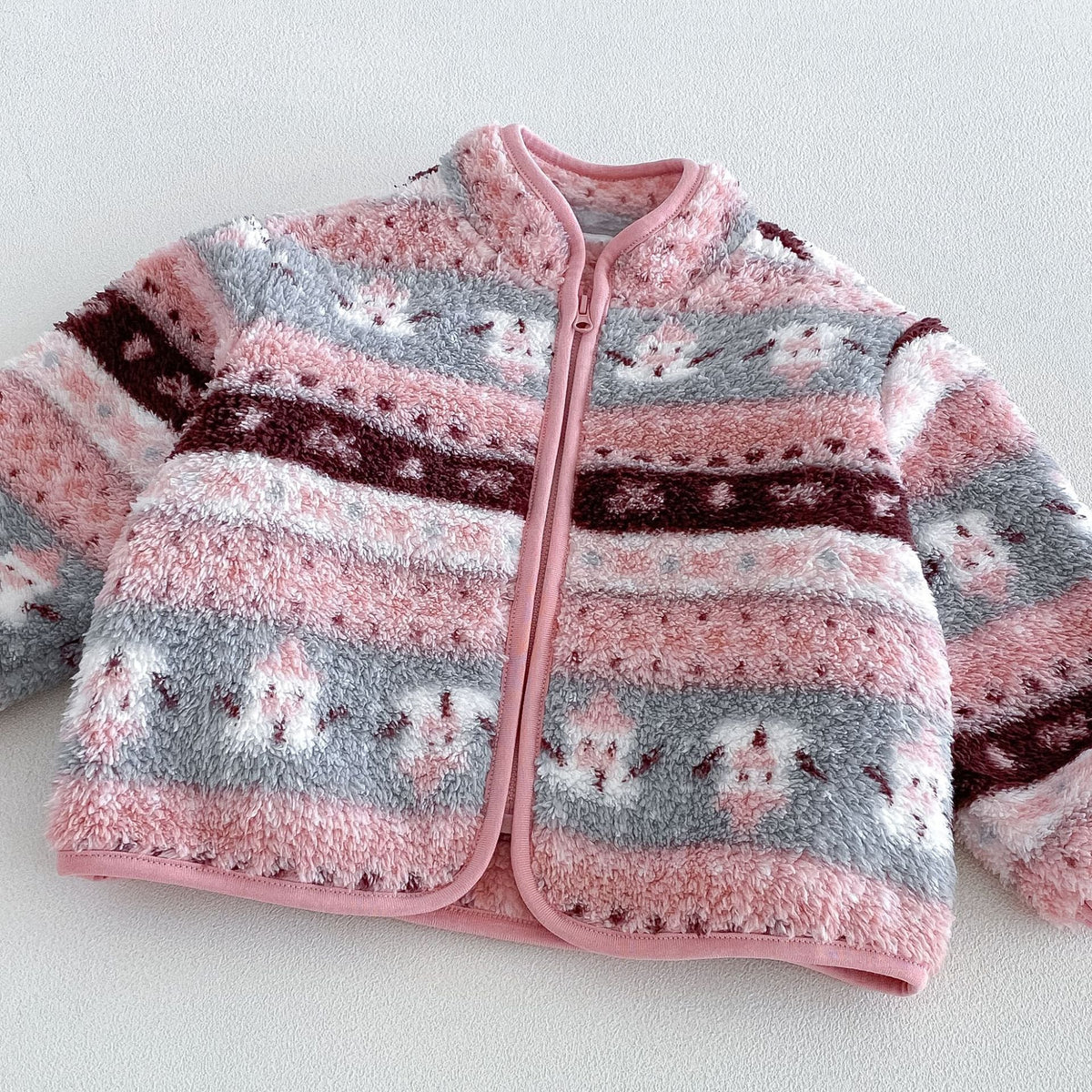 Close-up of the rose fleece jacket with full-length zip