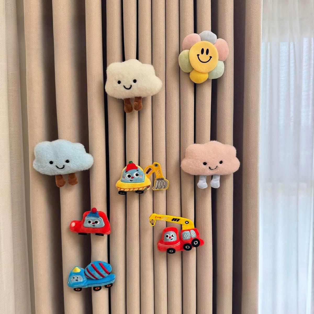 Set of eight plush curtain charms with clouds, a sunflower and vehicles