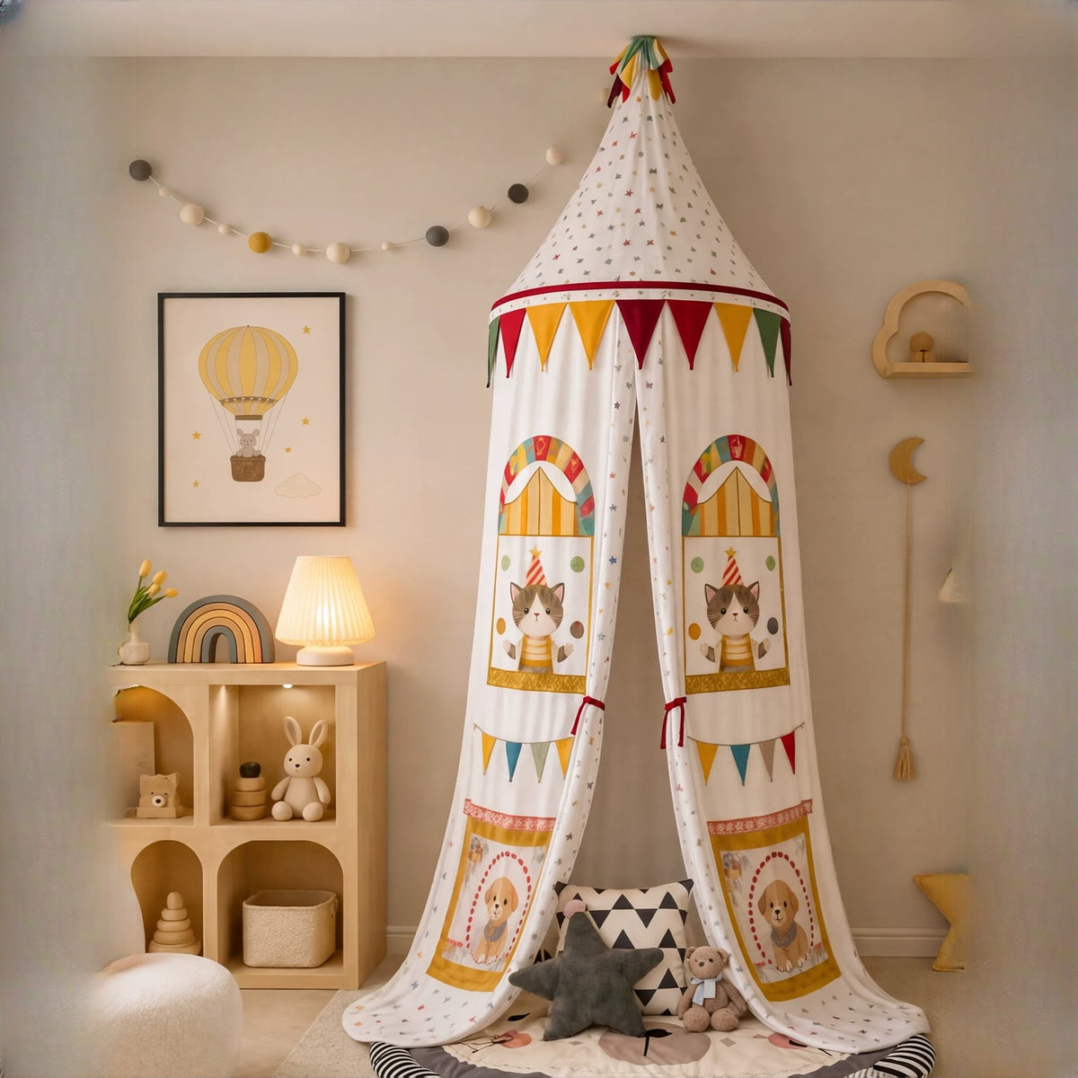 Circus canopy hanging from the ceiling above a play mat, curtains tied open