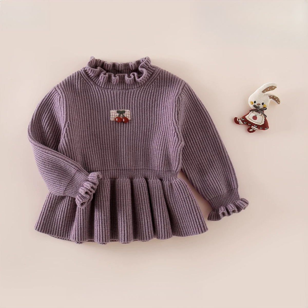Lilac ribbed knit peplum sweater with ruffle cuffs and cherry patch