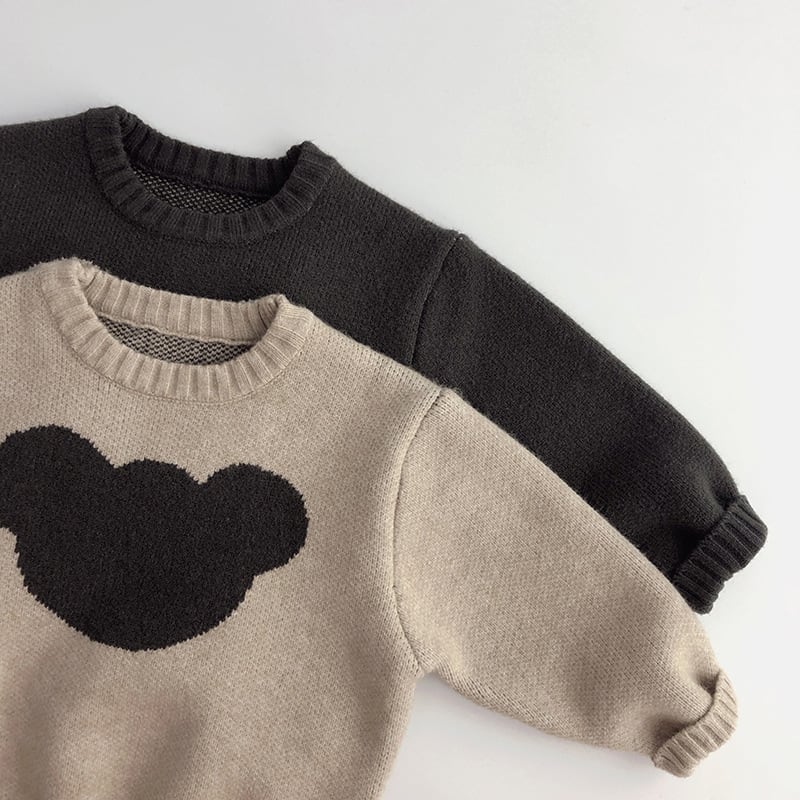 Oatmeal and charcoal bear sweaters layered together
