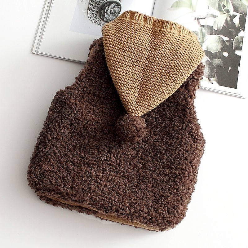 Cocoa brown sherpa vest with a tan knit hood and pom-pom