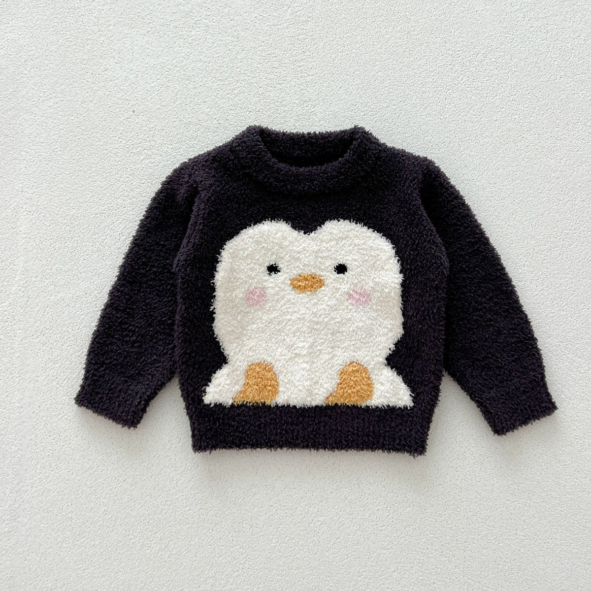Navy fuzzy knit sweater with a big penguin face