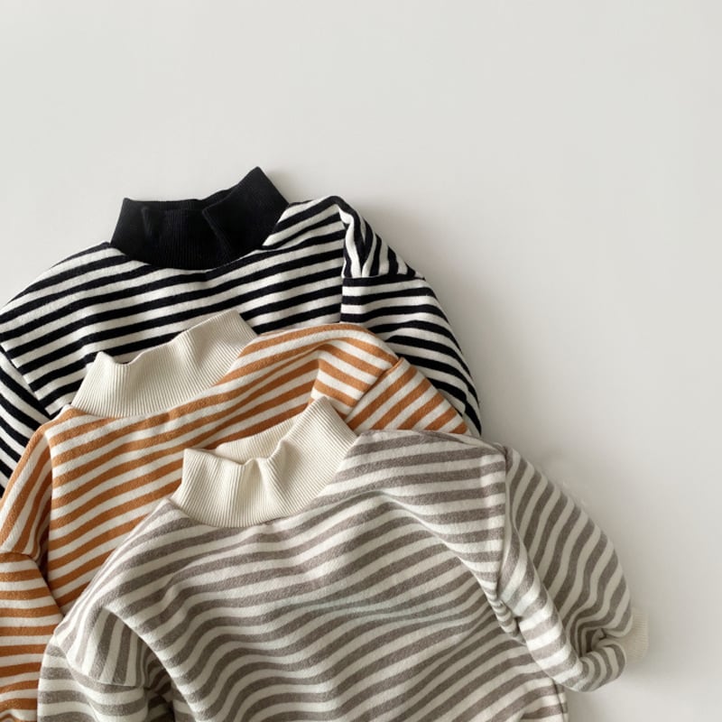 Stack of striped cotton tops in black, pumpkin and grey