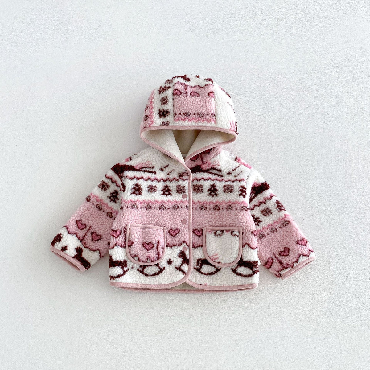 Rose pink hooded sherpa jacket with bunnies, hearts and tiny trees, flat lay