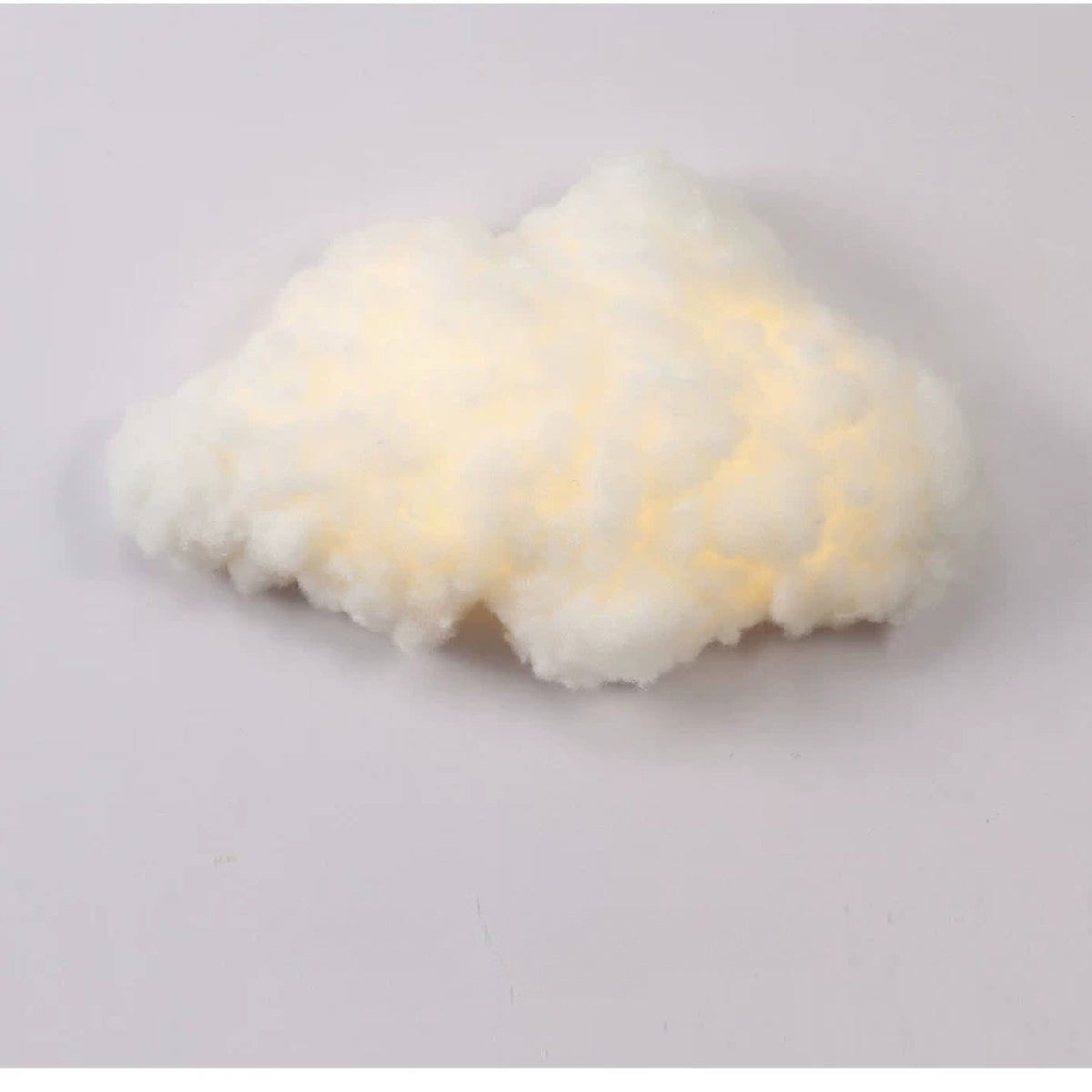 Silk-touch cloud wall lamp glowing warm white