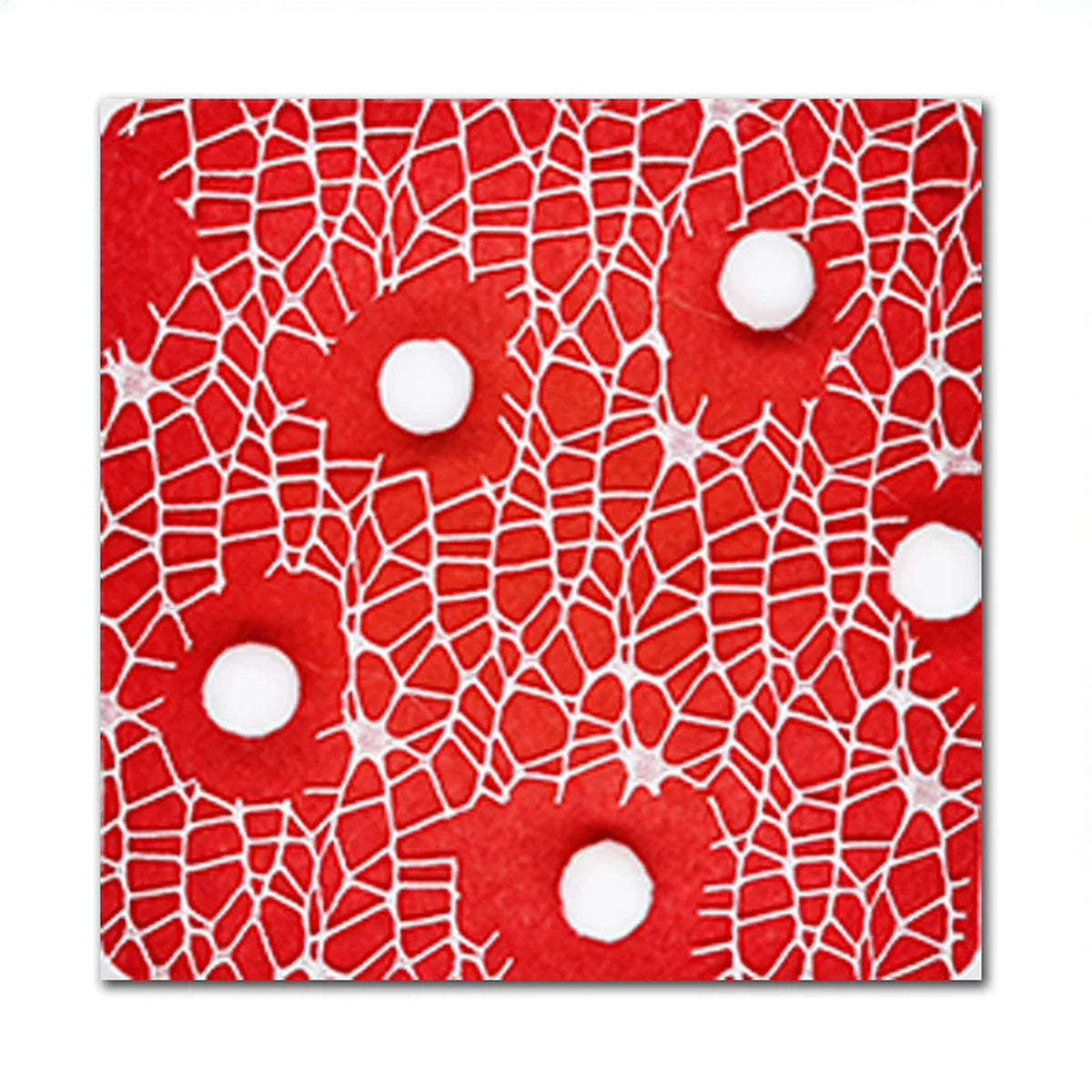 Close-up of a red crackle-pattern tile with soft white pom-poms