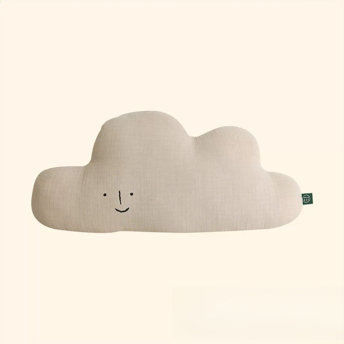 Beige cloud shaped muslin cushion