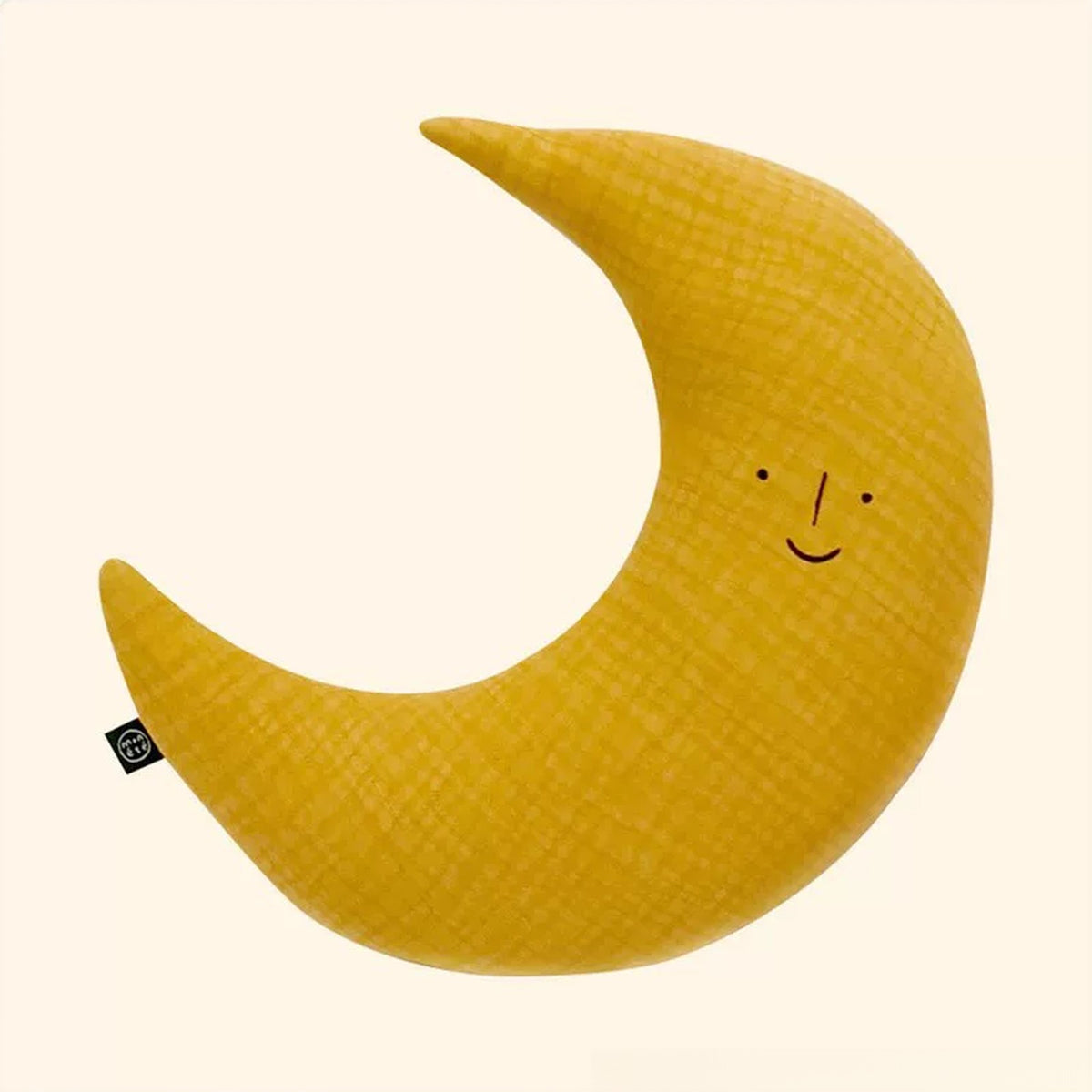 Mustard yellow crescent moon cushion with a sleepy smile