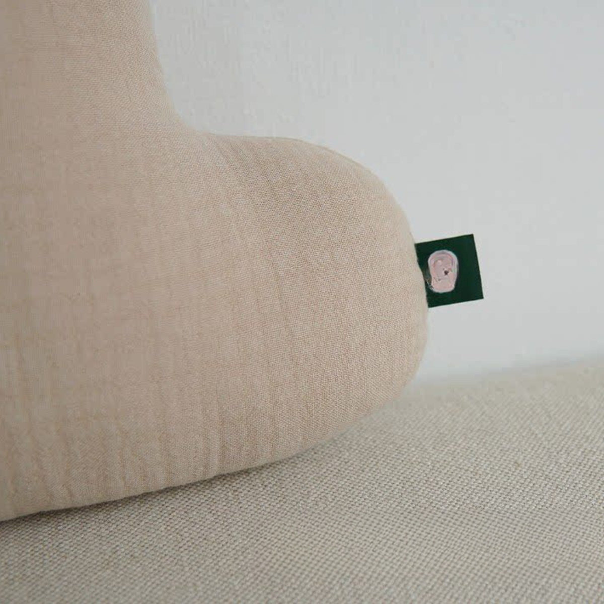 Close-up of the crinkled cotton muslin texture of the cloud cushion