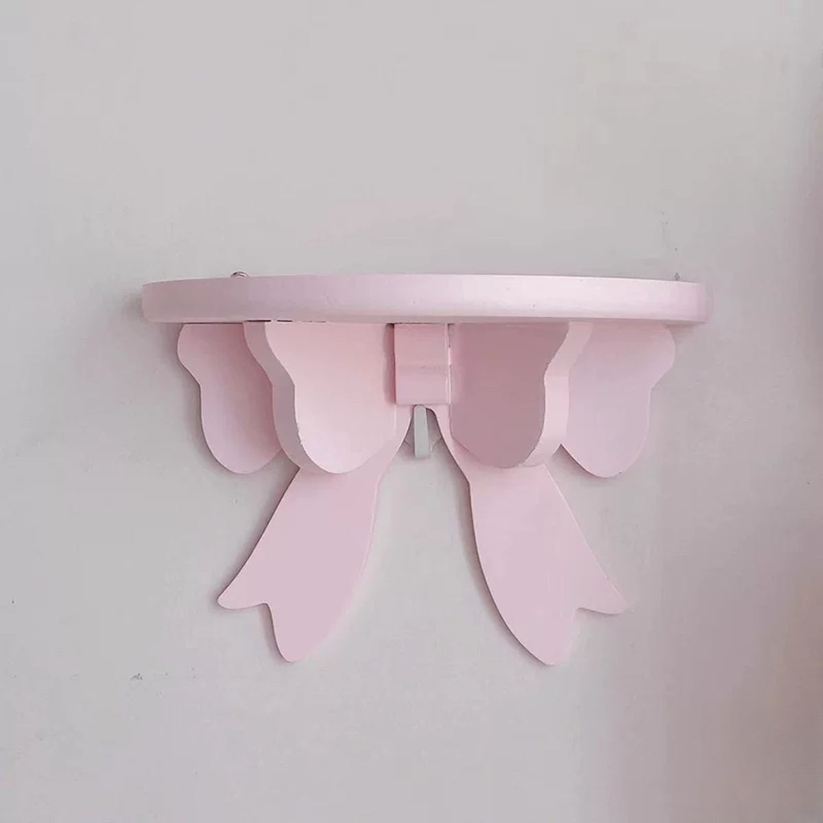 Pink wooden bow wall shelf