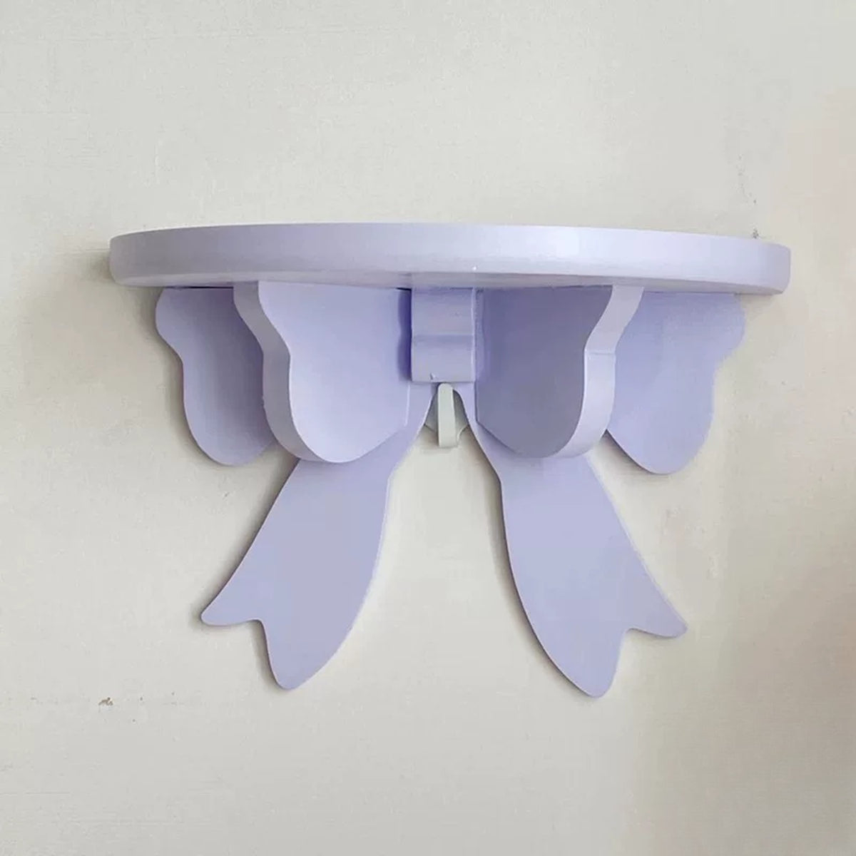 Lavender wooden bow wall shelf close-up