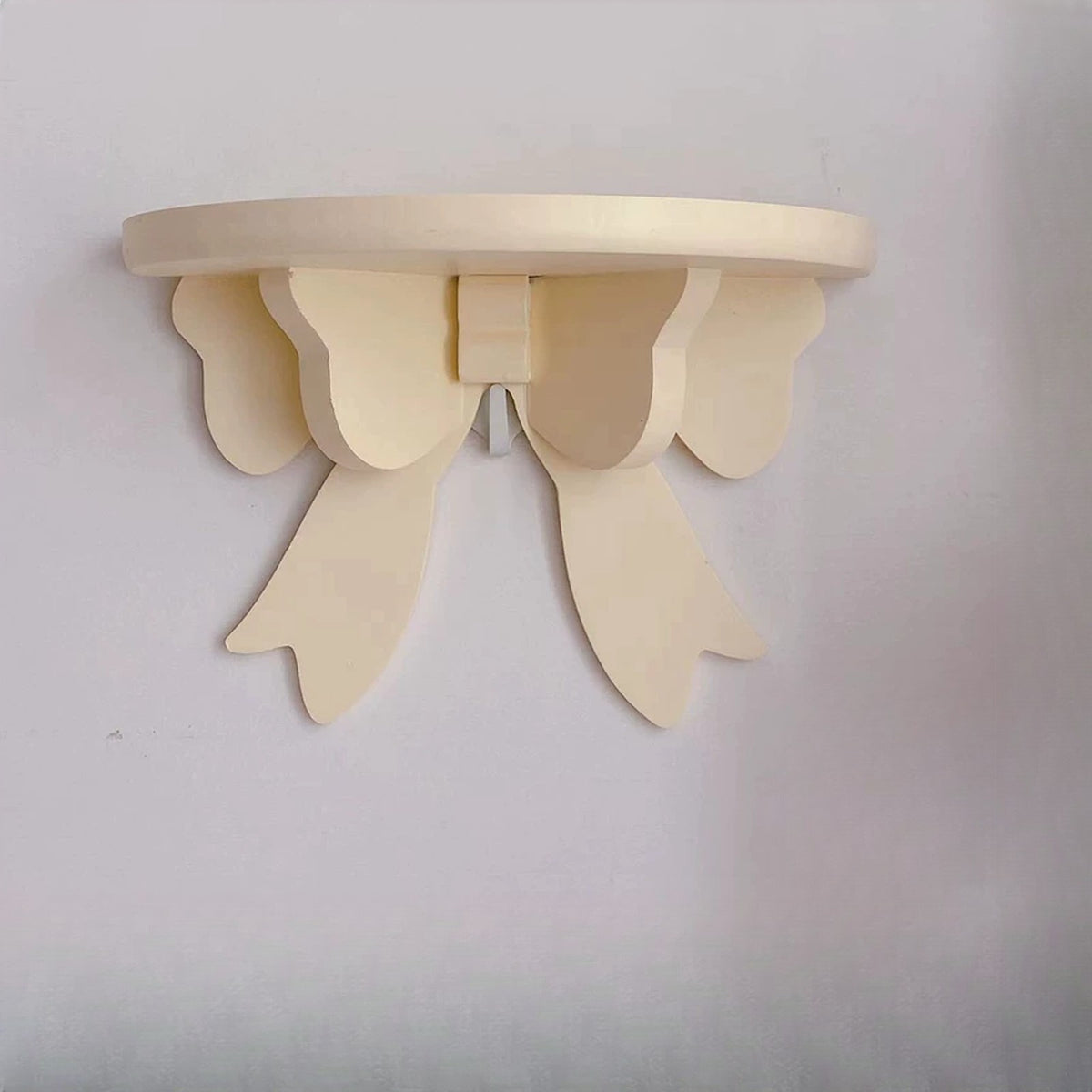 Butter yellow bow wall shelf