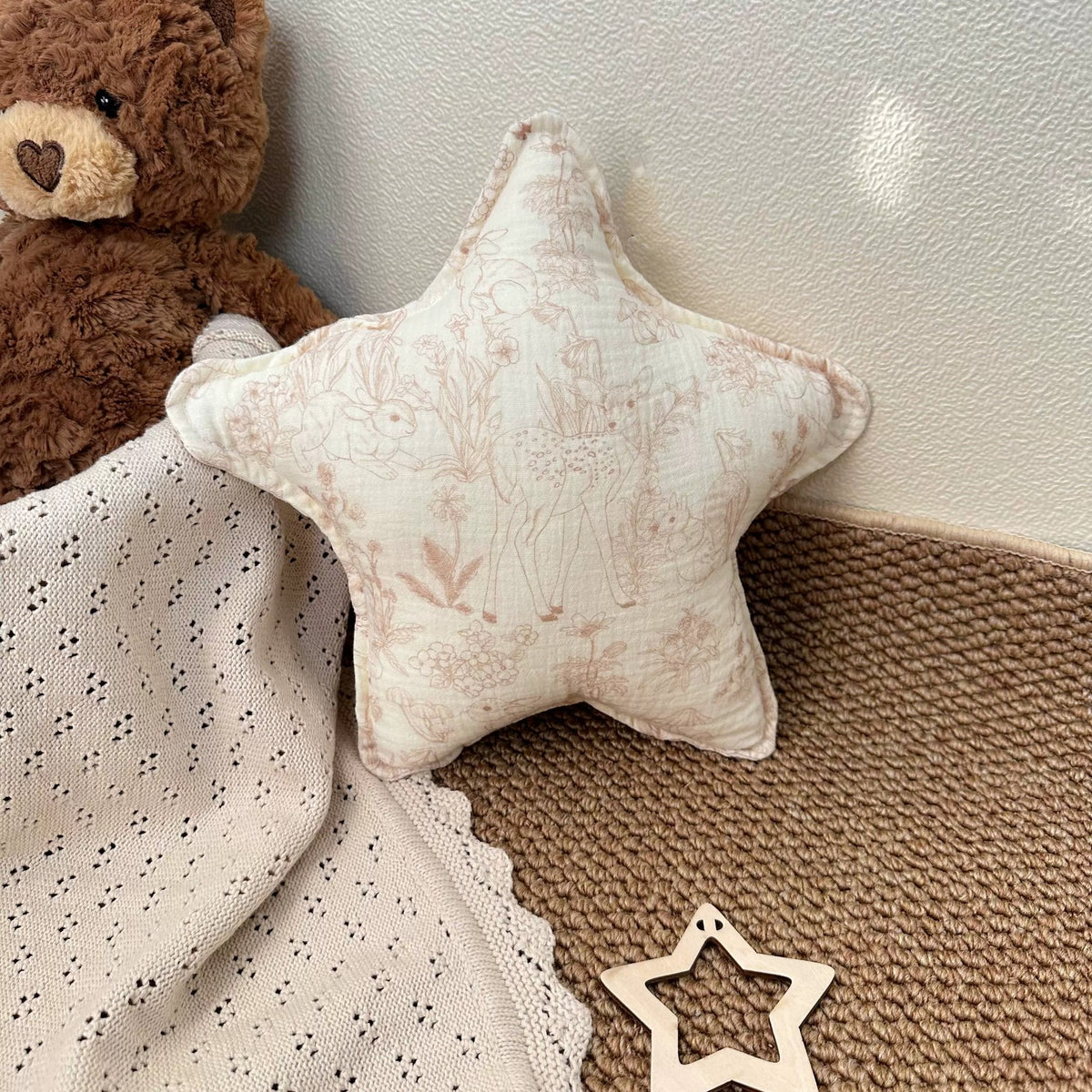 Fawn Garden blush line-art star cushion with a teddy bear
