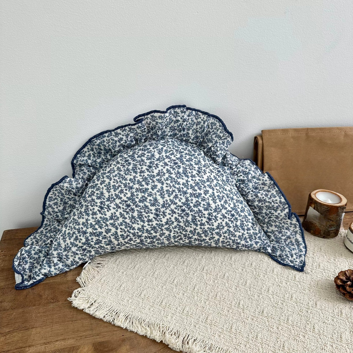 Ocean Floral ruffled dumpling cushion with navy trim
