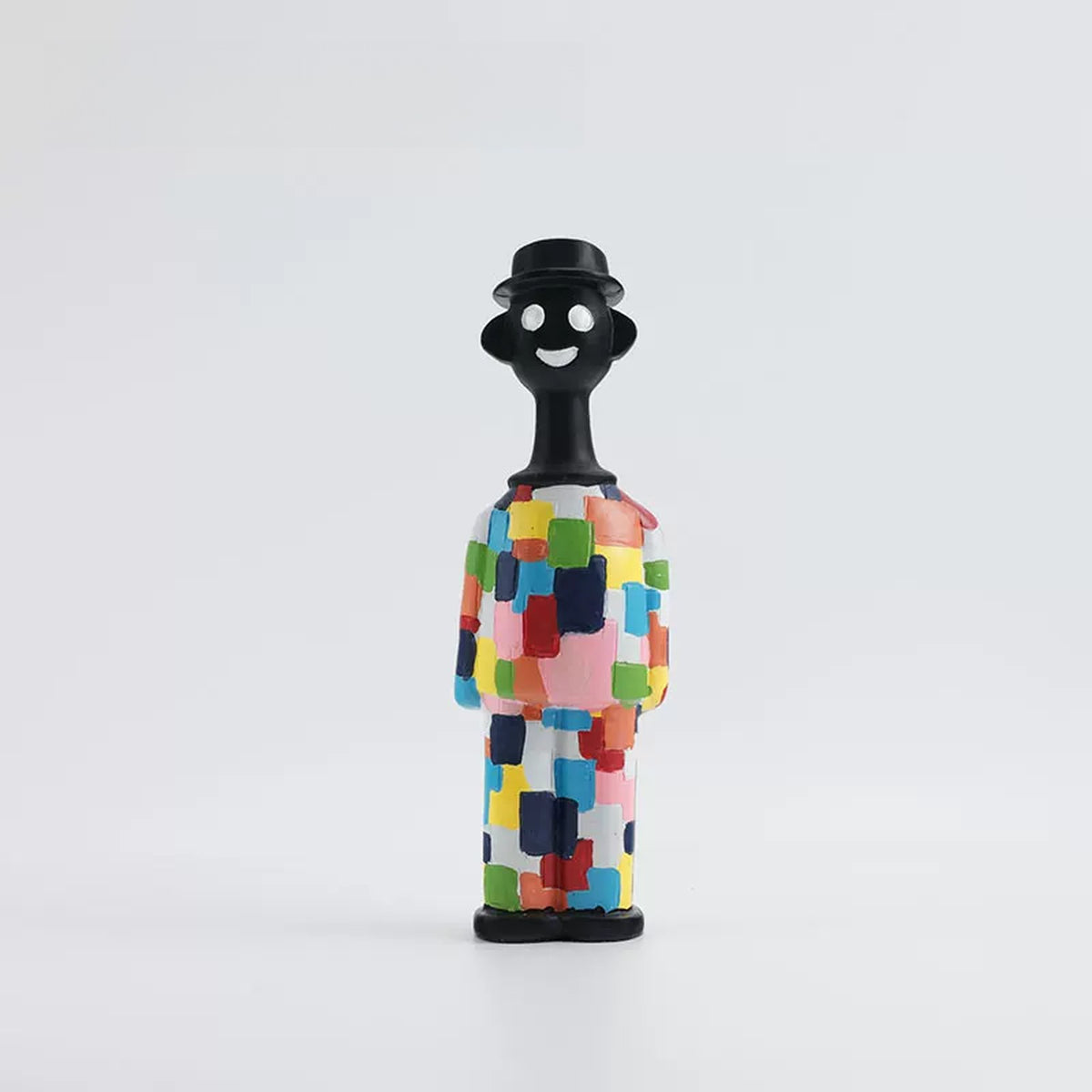 Patchwork Man figurine in a colourful painted suit and black hat