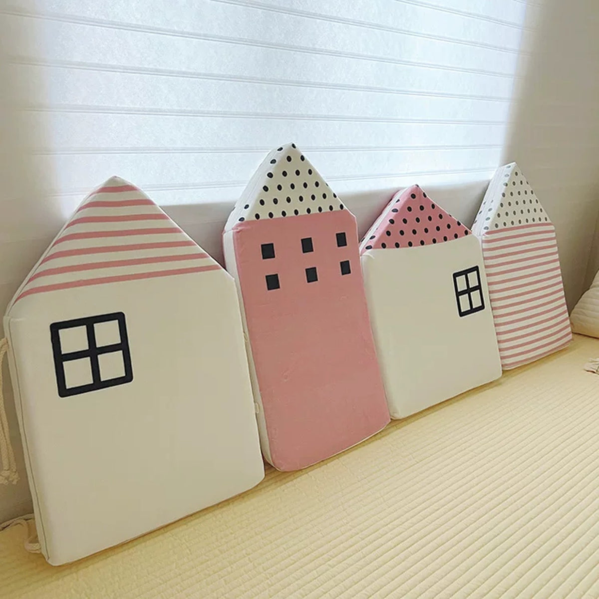 Blush Cottages cushions pieces along a bed