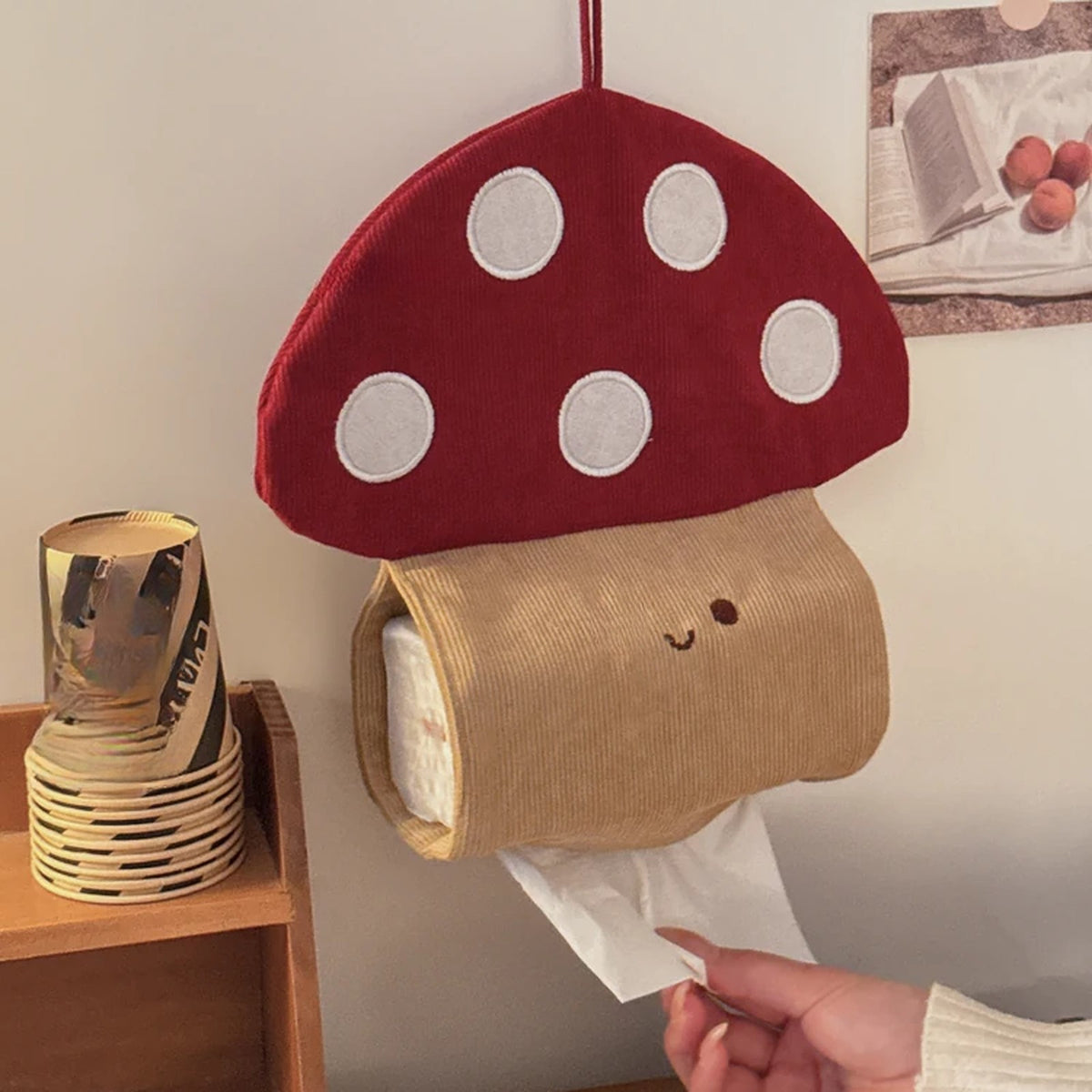 Pulling a tissue from the hanging mushroom tissue holder