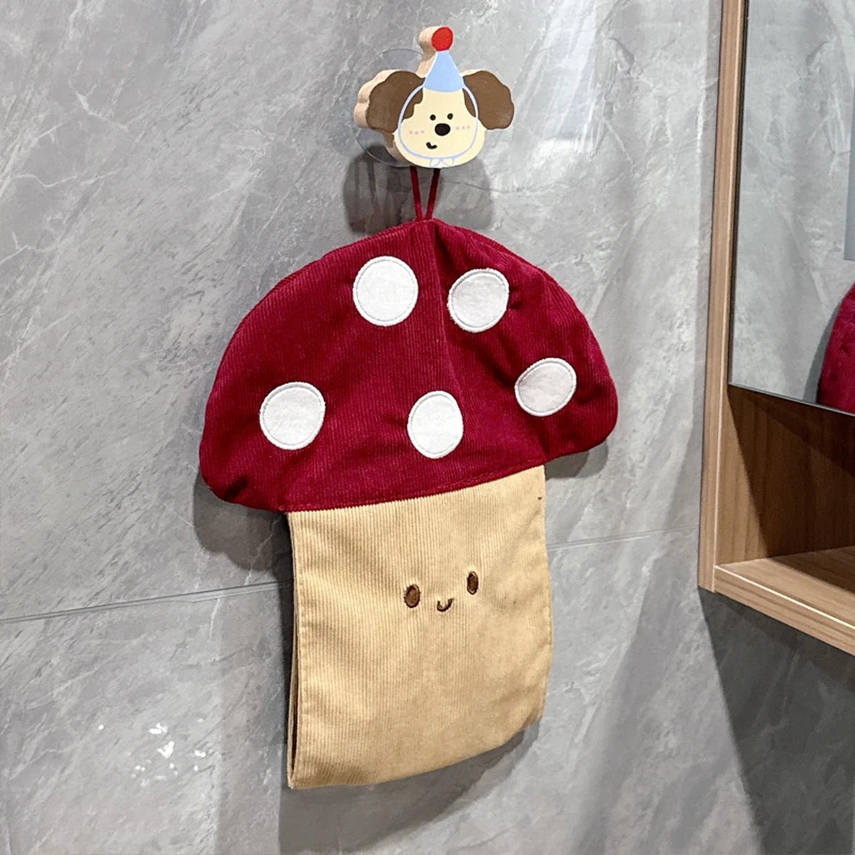 Mushroom tissue pouch hanging from a wooden puppy hook