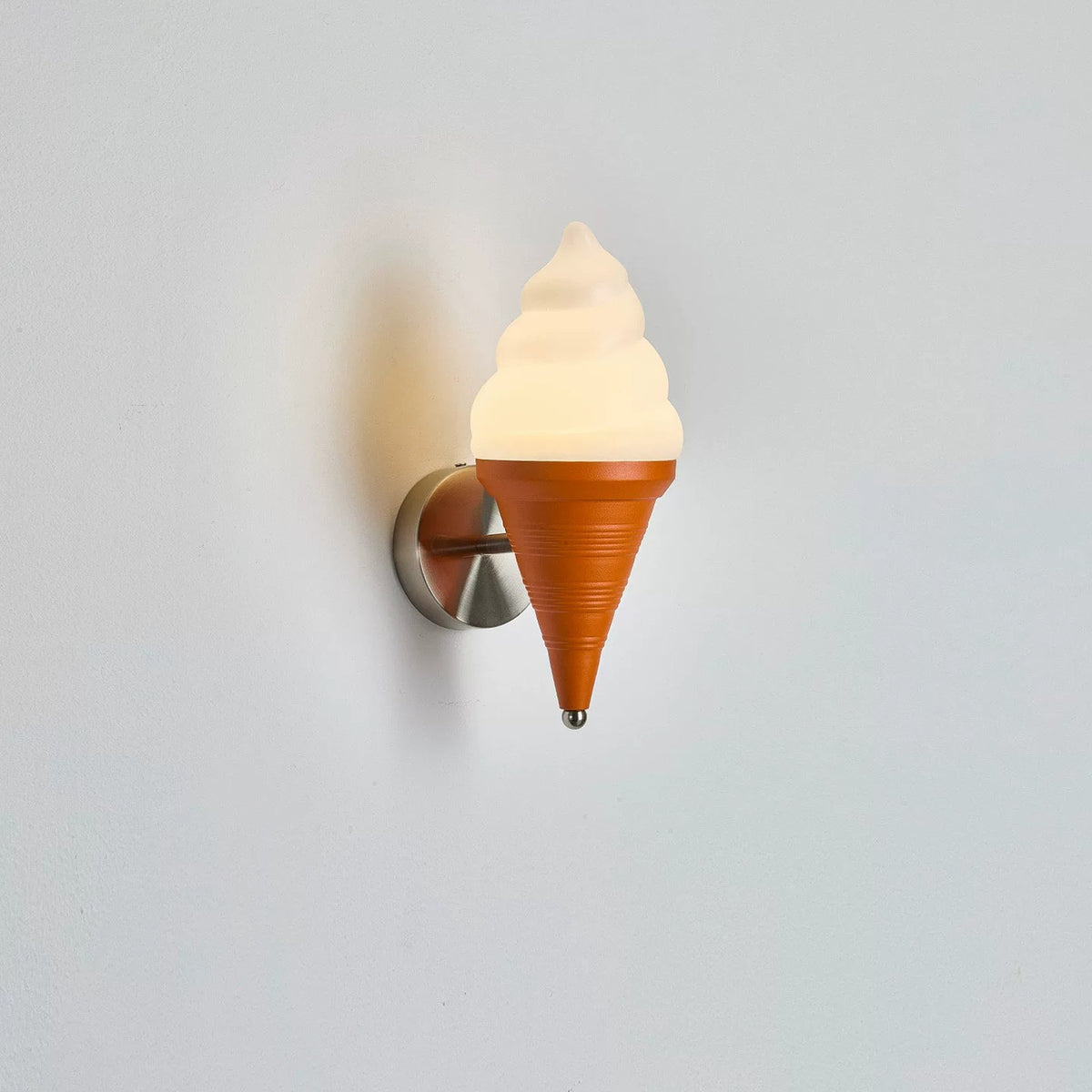 Side view of the ice cream wall sconce showing the brushed metal wall mount