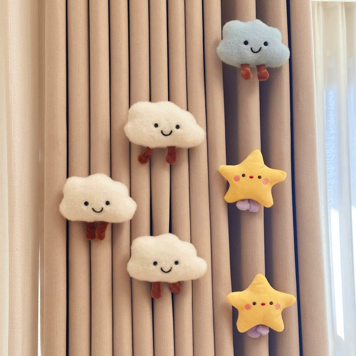 White and blue plush clouds with yellow stars on a curtain