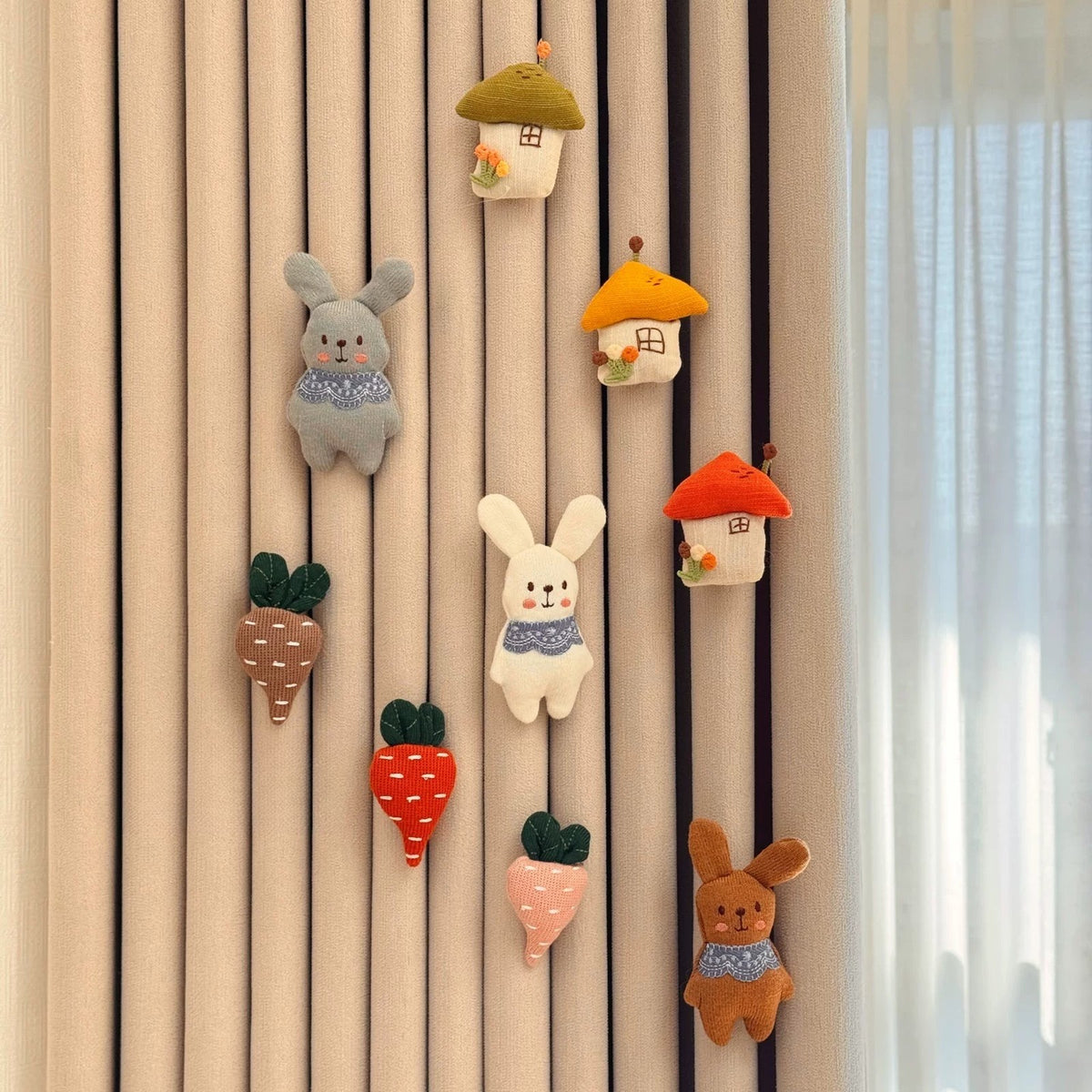 Bunny Village set: knitted bunnies, mushroom houses and carrots on a curtain
