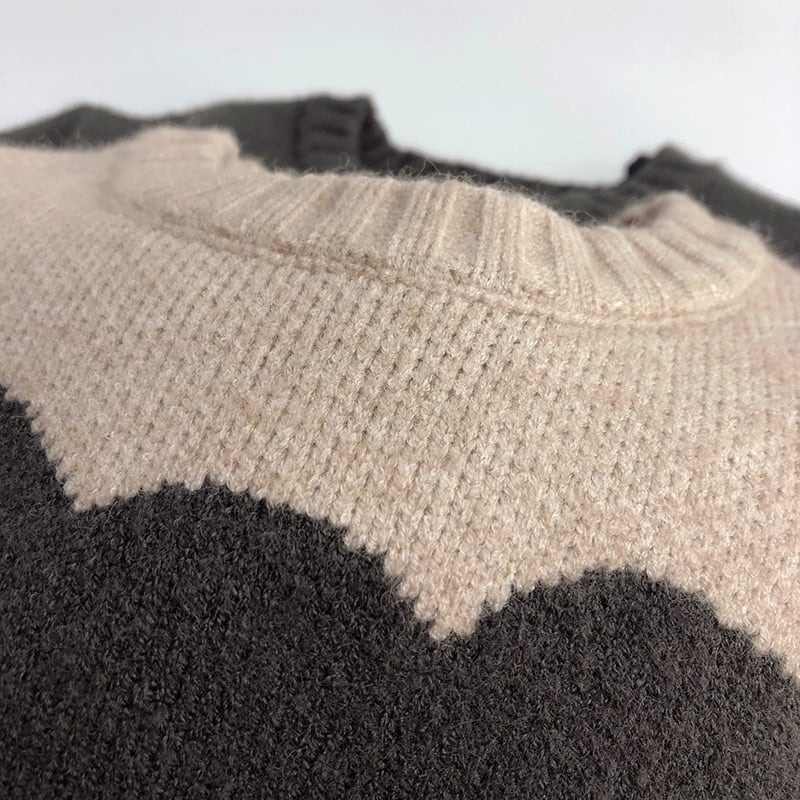 Close-up of the soft knit texture and teddy bear design