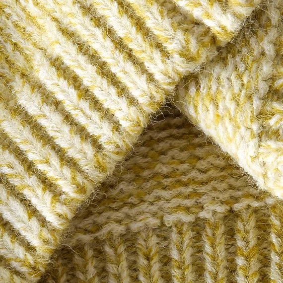 Close-up of the soft heathered rib knit on a girls sweater vest