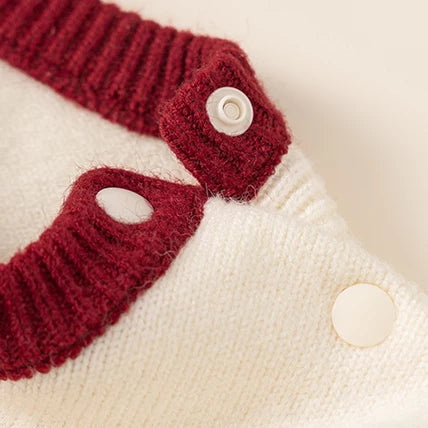 Red ribbed collar with shoulder snap on the knit romper
