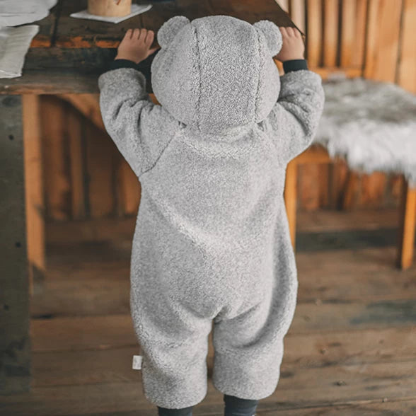 Back view of the grey bear-ear hood on a teddy fleece romper