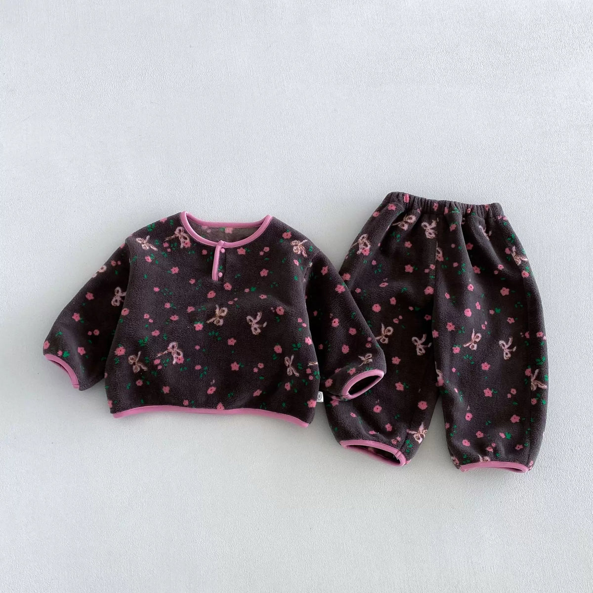 Charcoal blossom floral fleece pajama set, flat lay