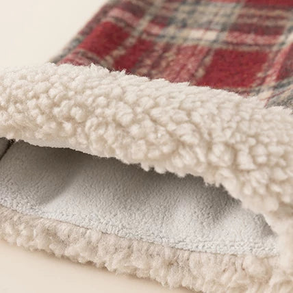 Sherpa-trimmed cuff of the red plaid pants