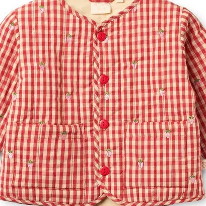 Close-up of the red gingham jacket with button front and patch pockets