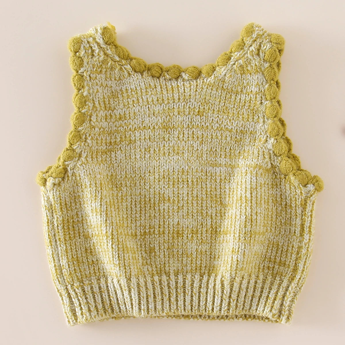 Back view of a matcha green bobble-trim knit vest for girls
