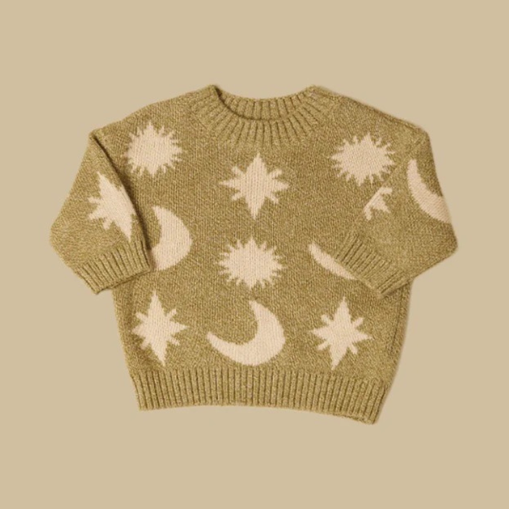 Olive green kids sweater with cream sun, star and moon pattern, flat lay