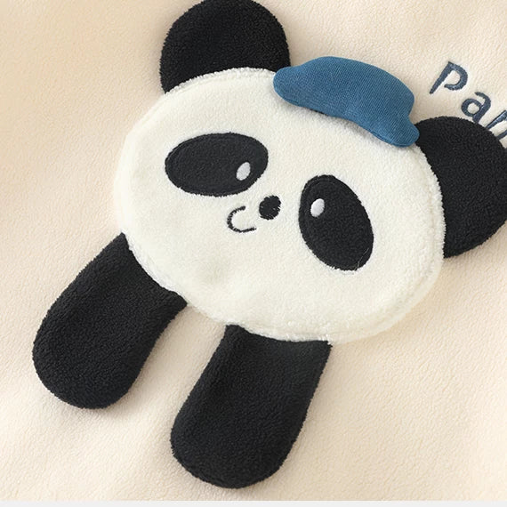 Close-up of the soft plush panda appliqué on the apricot romper