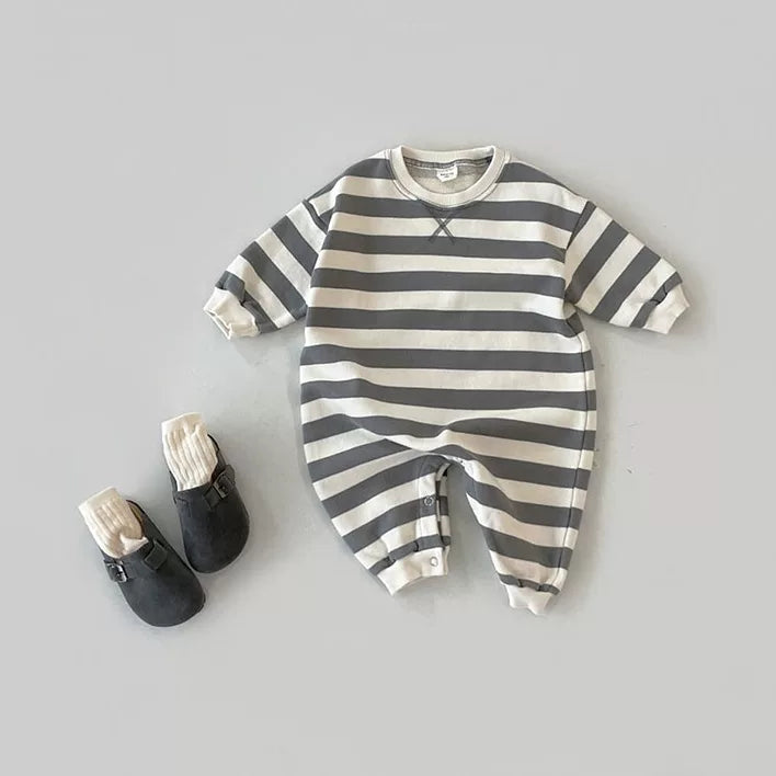 Charcoal stripe long-sleeve baby romper flat lay with grey baby shoes
