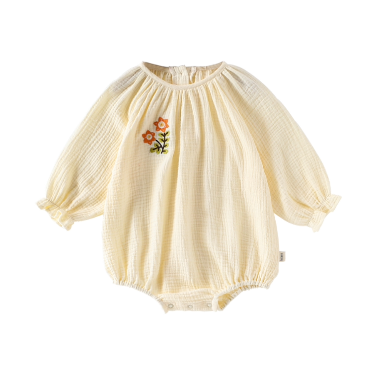 Apricot double gauze bubble romper with embroidered flower, flat lay