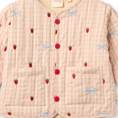 Close-up of the pink gingham jacket with embroidered strawberries and bows