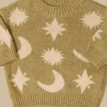 Close-up of the soft olive knit with cream suns, stars and crescent moons