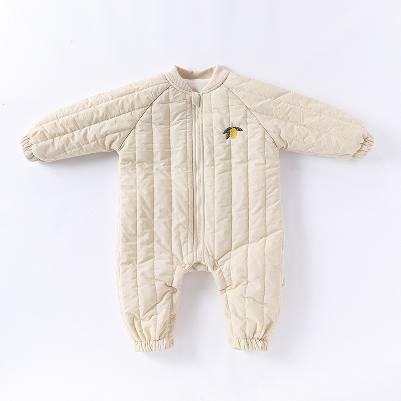 Lemon cream quilted baby romper with zip front, flat lay