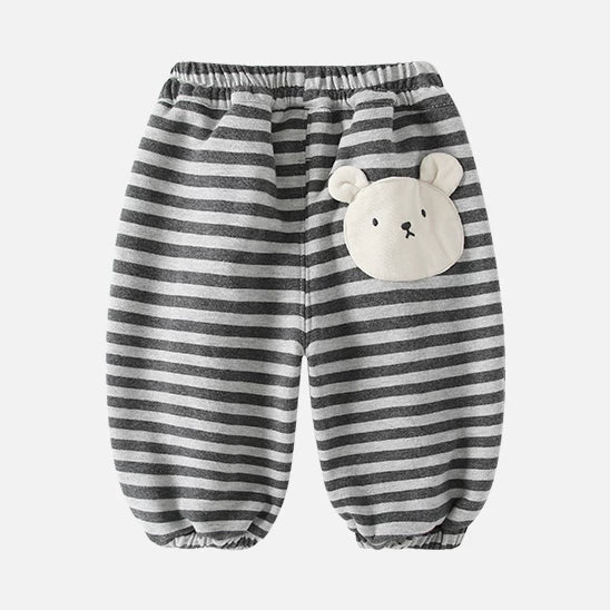 Back of striped toddler sweatpants with a cream teddy bear patch