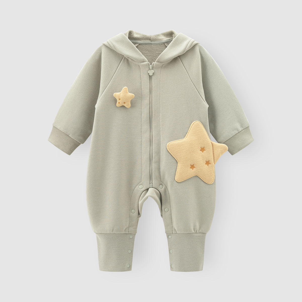 Sage green hooded baby romper with padded yellow stars, flat lay
