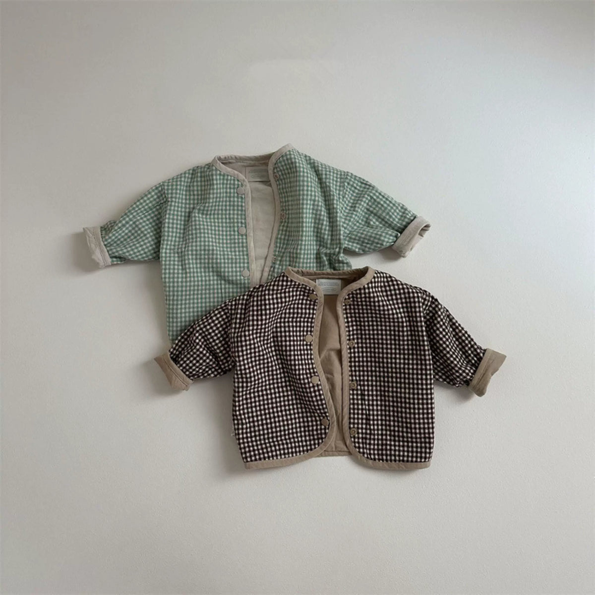 Sage gingham and brown check reversible jackets with contrast trim