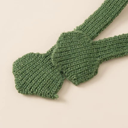 Close-up of the knitted frog-foot ends on the hat ties