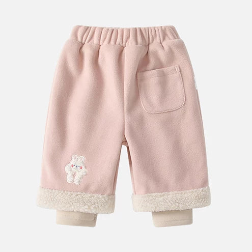 Blush pink fleece-lined baby pants with bunny embroidery, back view