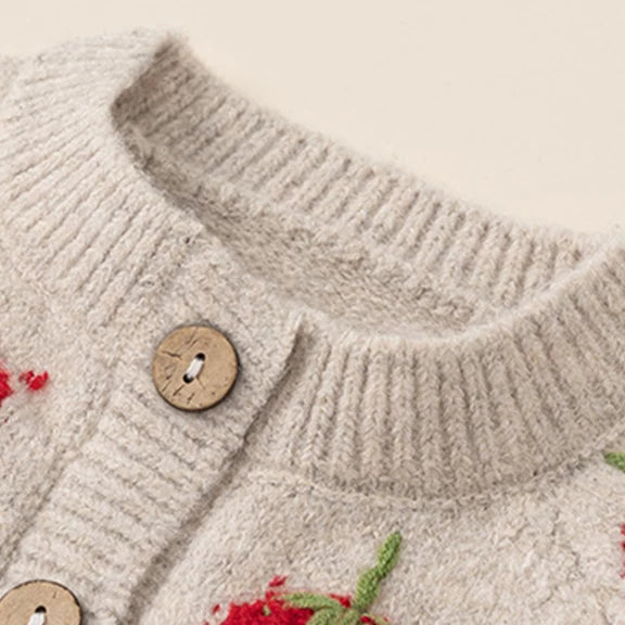 Round neck, buttons and textured strawberry detail