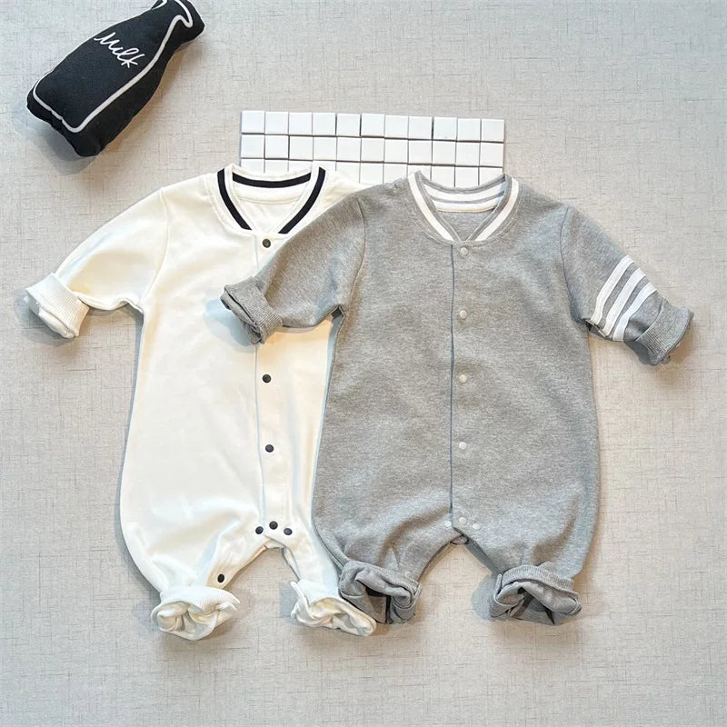 Snow white and heather grey varsity rompers, flat lay