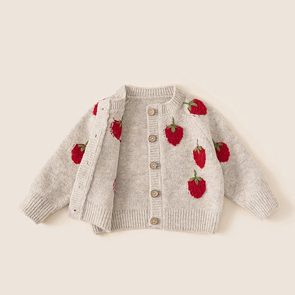 Strawberry cardigan laid open showing button front