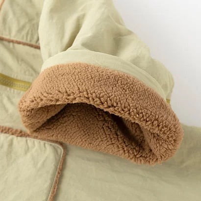 Brown sherpa-lined leg cuff and piped patch pocket